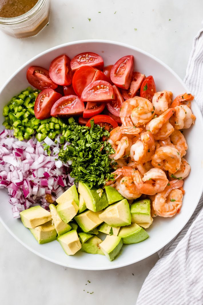Mexican Shrimp Salad - Just 15 minutes to prepare from start to finish! Loaded with buttery avocados, tomatoes, sautéed shrimp, and a refreshing dressing! #shrimpsalad #mexicanshrimpsalad #shrimpavocadosalad #salad #dinnerrecipes #shrimprecipes | Littlespicejar.com