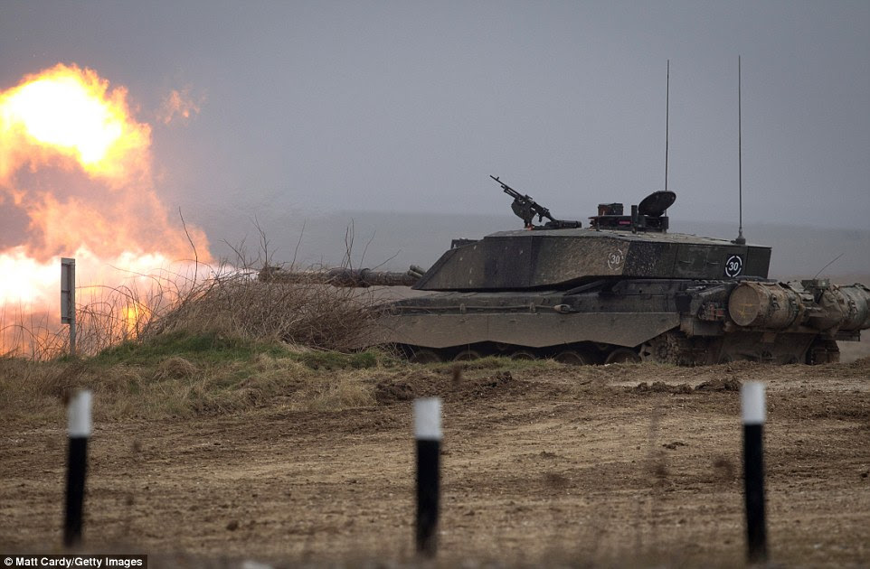 Fire! A huge ball of flames can be seen as a tank fires its weapon during the first day of the three-week military exercise