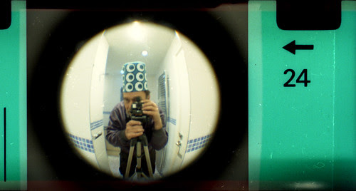 reflected self-portrait with Fisheye Baby camera and halloween hat by pho-Tony