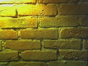 English: a yellow bricks wall in a restaurant