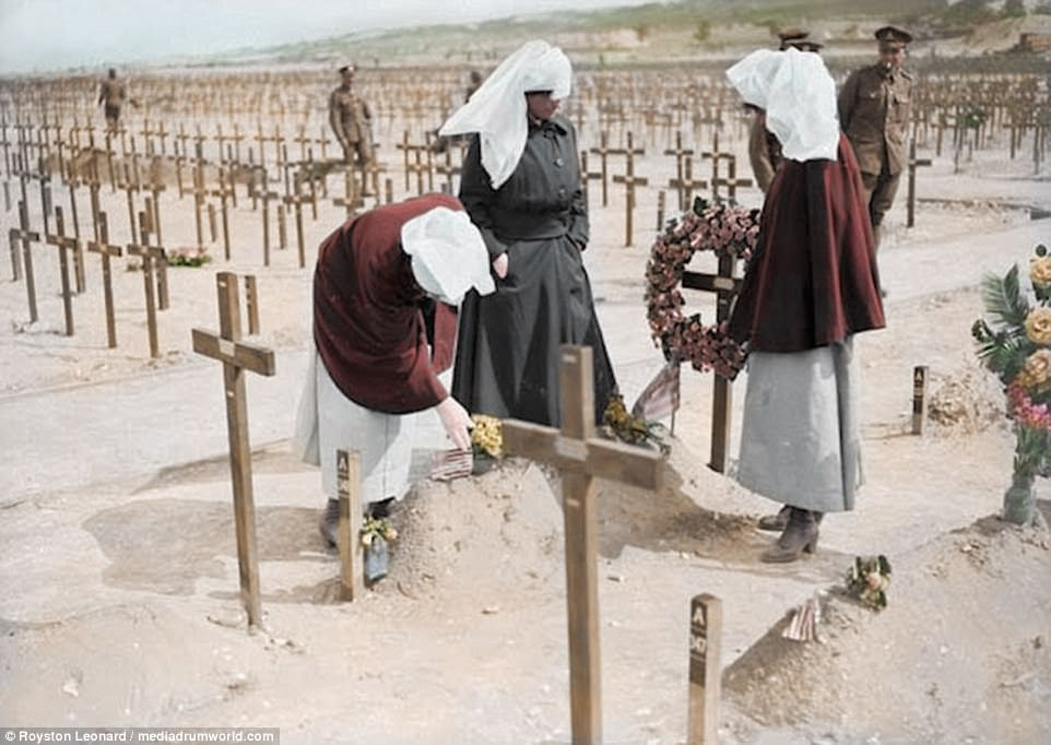 This picture shows nuns laying wreaths in a field of mass graves. The total number of military and civilian casualties in World War I was around 40million