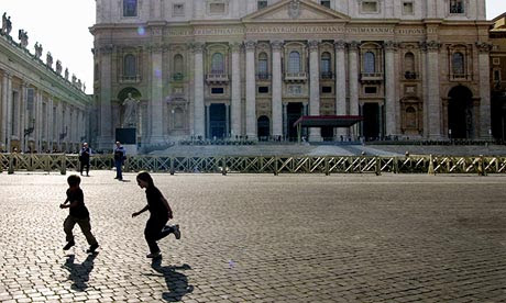 Children play in St Peters' Square at the Vatican.