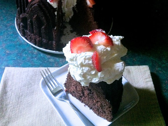 Slice of Red Wine Chocolate Bundt with Mascarpone Whipped Cream and Berries