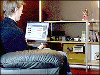 Image of a man at a laptop