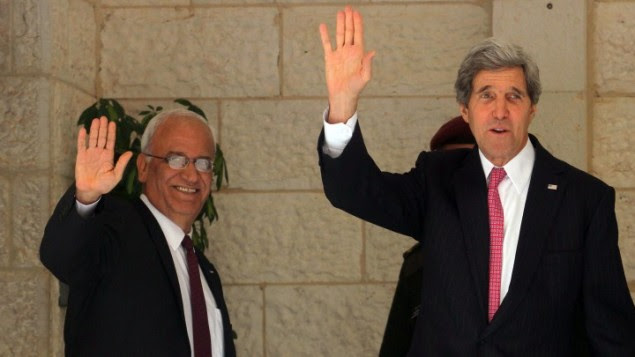 US Secretary of State John Kerry (R) and Palestinian chief negotiator Saeb Erekat wave before a meeting with Palestinian Authority President Mahmoud Abbas at the presidential compound in the West Bank city of Ramallah January 4, 2014. (photo credit: Issam Rimawi/Flash90)