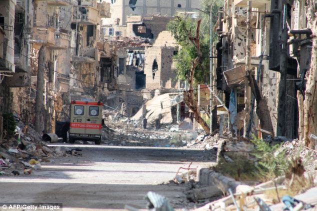 A heavily damaged street in Syria's eastern town of Deir Ezzor
