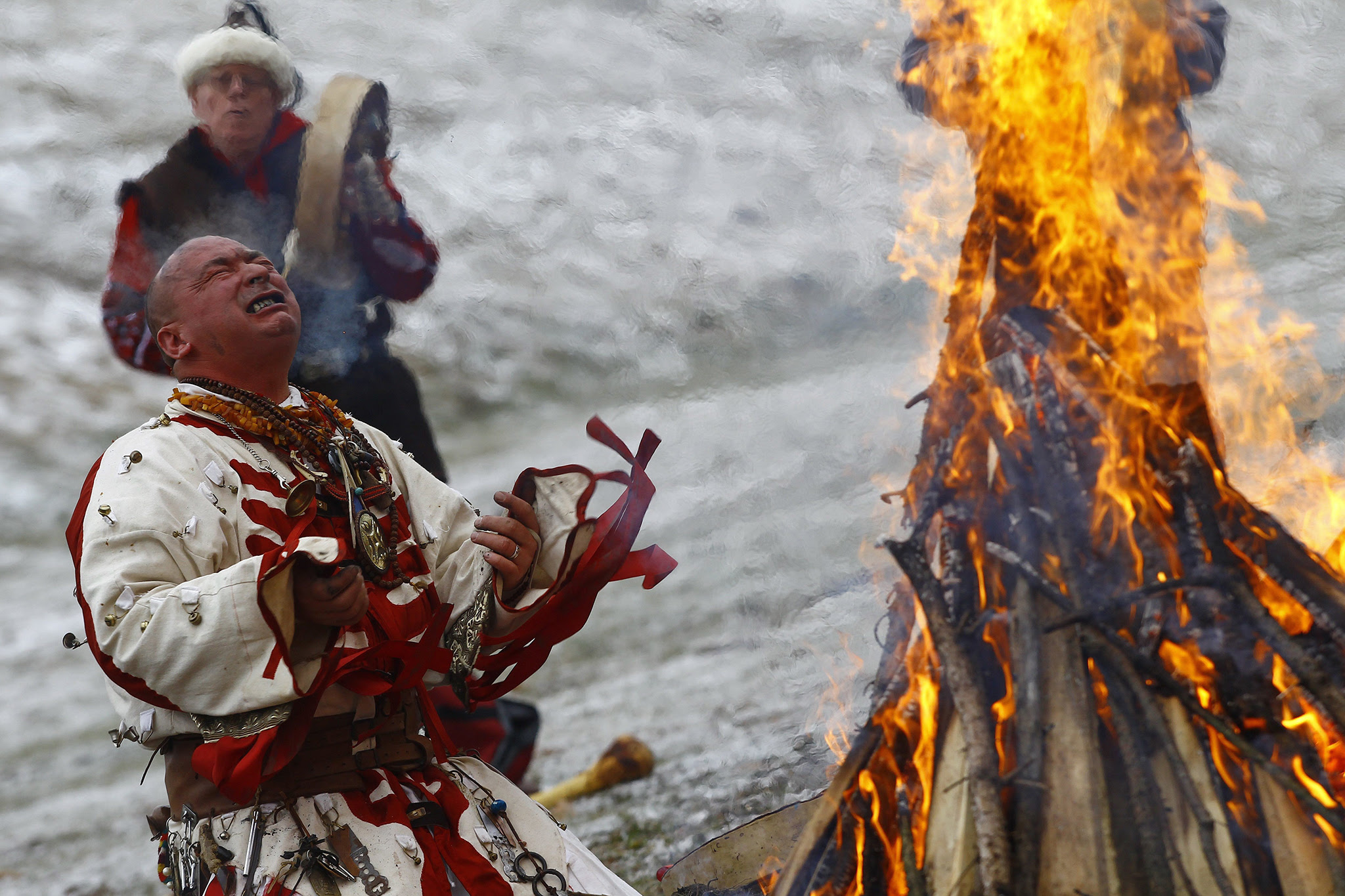 ungarian Artist Miklos Zoltan Baji performs a shamanic ritual around a bonfire during winter solstice celebrations in Bekescsaba, 200 kms southeast of Budapest, Hungary, Wednesday, Dec 21, 2016, on the shortest day of the year. (Peter Lehoczky/MTI via AP)