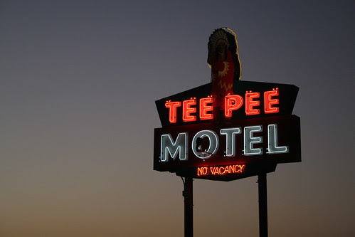closer on tee pee motel sign at sunrise