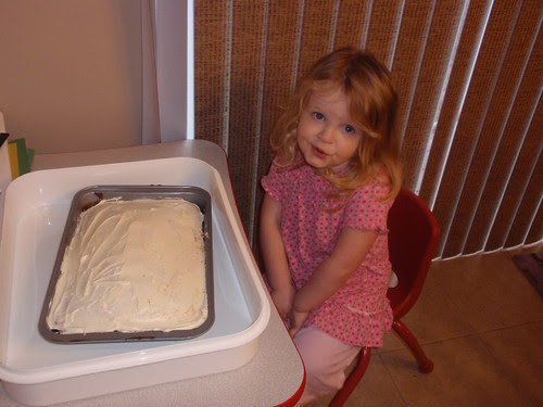 03.28.10 Libby getting ready to decorate Daddy's birthday cake