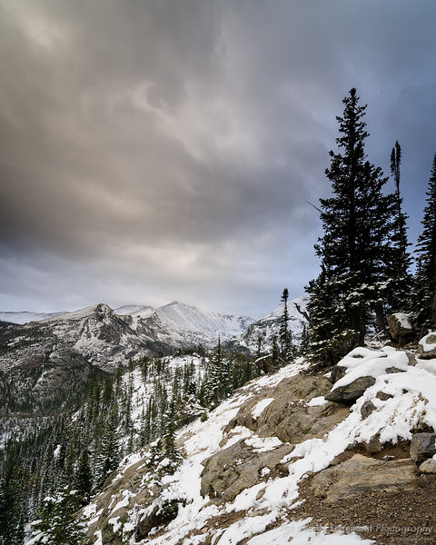 Along the trail to Lake Haiyaha - Longs peak in the mist Along the trail to Lake Haiyaha - Longs peak in the mist