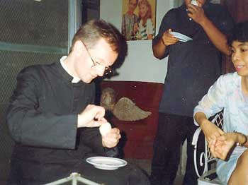 Fr. Abraham eating balut