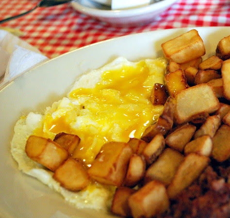 Perfectly over-easy eggs and home fries!