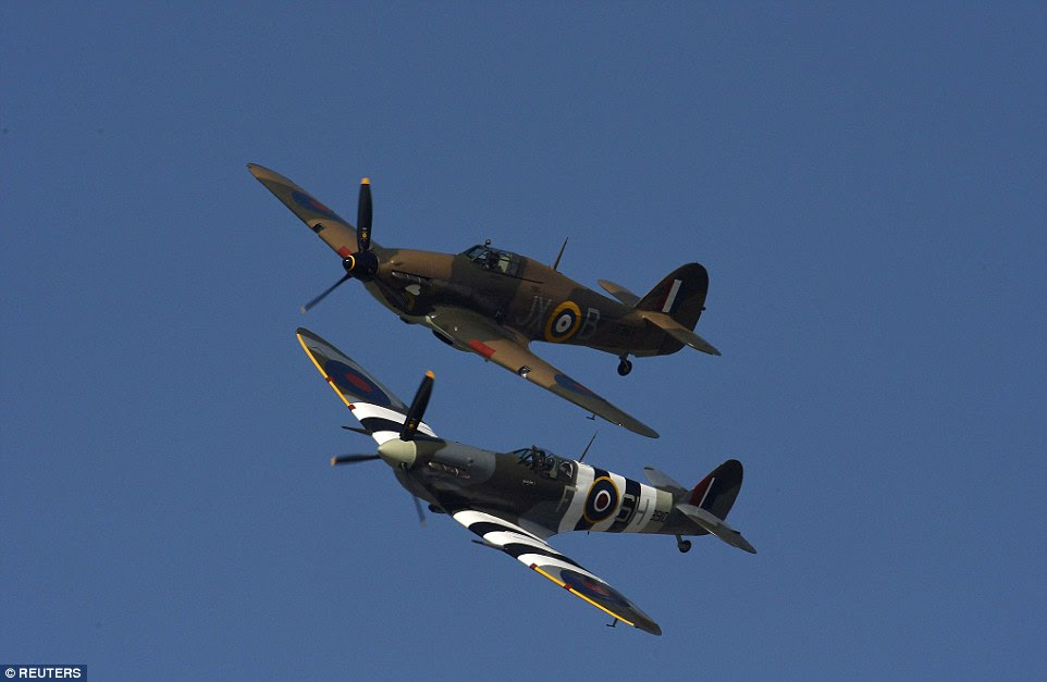 A Spitfire and a Hurricane fighter plane performed a military fly-past, a touching salute to the air support the RAF gave during the operation