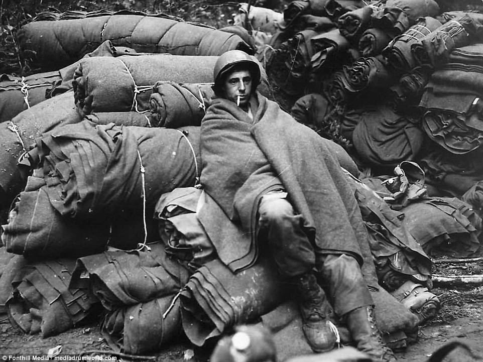 A US soldier on bedrolls after the first night in the Battle of the Bulge 