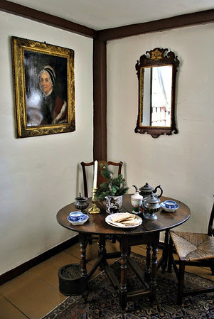 Period table in the front room with the portrait of Aunt Ruth above.