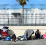Homeless women sit amid their belongings in downtown Los Angeles on Wednesday. Democrats and Republicans say income inequality is a problem, but they disagree over a solution.