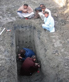 Researchers collect samples from a trench to determine the nature of the landforms in the area of the Indus River plains once occupied by the Harrapans.  