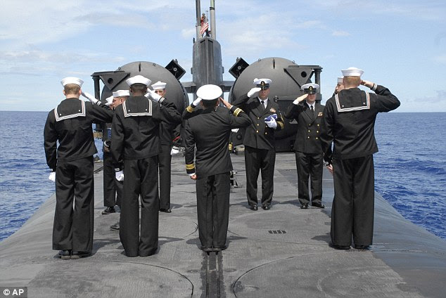 Survivors: The crew of USS Ohio salute during a special burial ceremony at sea for Indianapolis survivor Eugene Morgan
