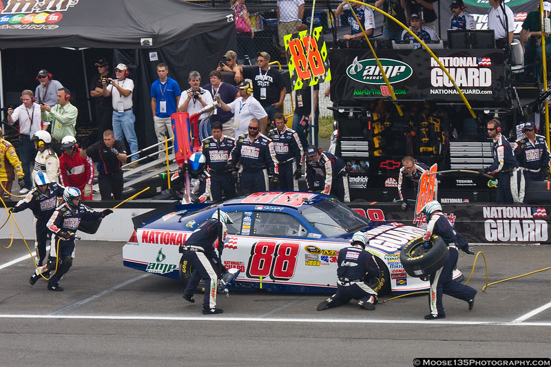Dale Earnhardt, Jr. comes to the attention of his pit crew. Dale Earnhardt, Jr. comes to the attention of his pit crew.