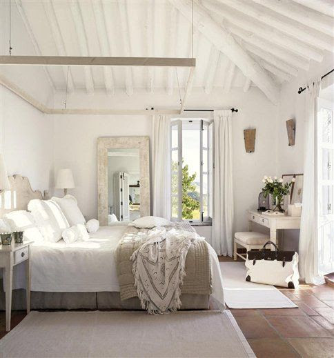 perfect beach house guest bedroom - love the big mirror with the distressed wood frame leaning against the wall