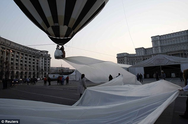 A Guinness World Record for the longest train of a wedding dress is attempted in front of the Parliament Palace