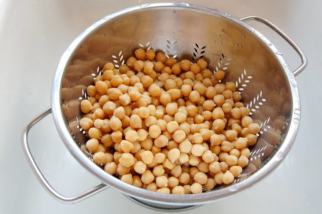 Chickpeas draining in colander in sink by Eve Fox, Garden of Eating blog copyright 2011