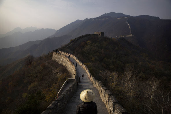 Scholars say the Great Wall of China is disappearing as a result of erosion, theft of bricks and damage from tourists scrambling over unrestored sections.