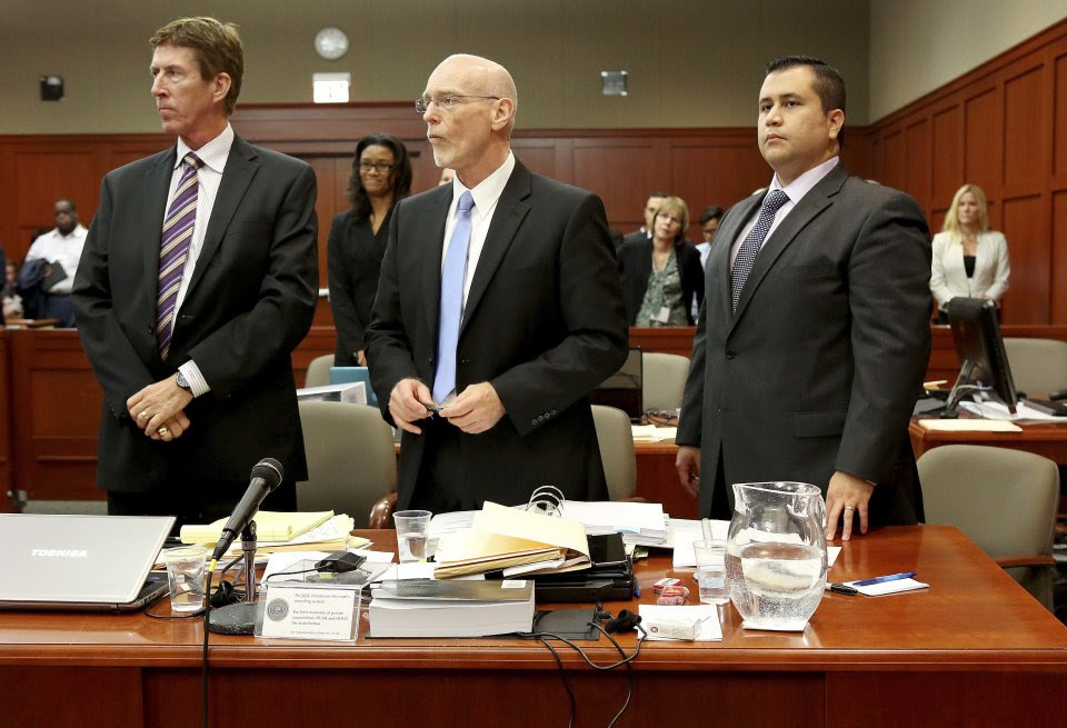 Defense attorneys Mark O'Mara, left, Don West, center, stand with George Zimmerman during Zimmerman's trial in Seminole circuit court, in Sanford, Fla., Wednesday, July 3, 2013. Zimmerman is charged with second-degree murder in the 2012 fatal shooting of slain teen Trayvon Martin. (AP Photo/Orlando Sentinel, Jacob Langston, Pool)