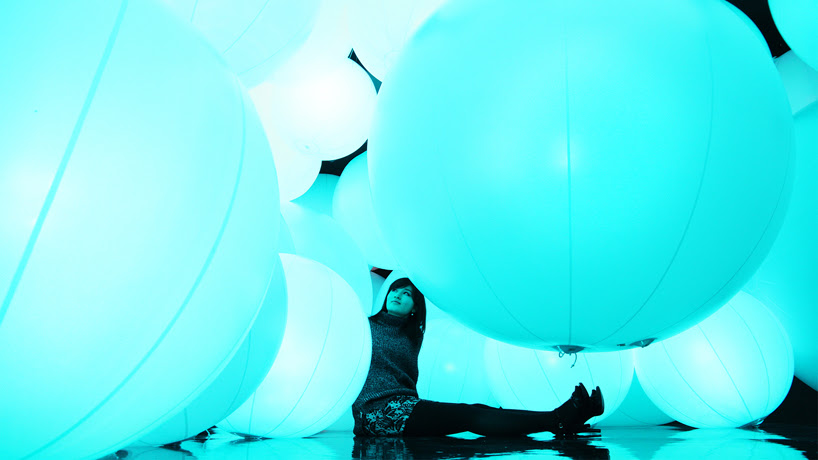 luminous colored spheres by team lab respond to human touch