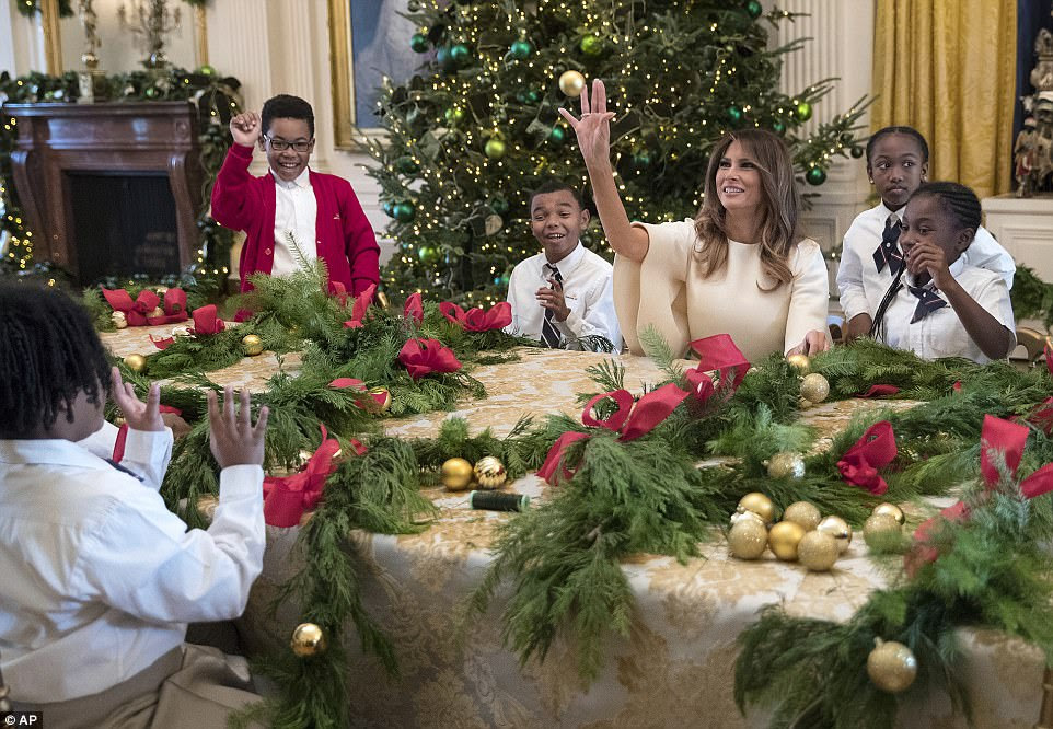 The kids in the East Room made garland while telling the first lady that she looked like 'an angel' and giving her a group hug 