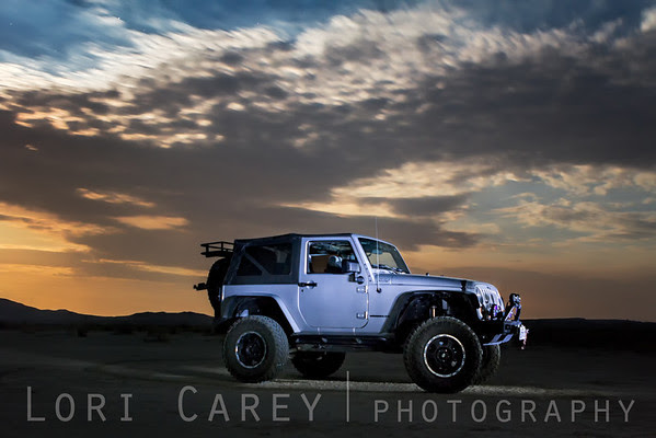 Jeep at sunset on desert playa