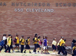 Students leave Atlanta's Emma Hutchinson School in July. Hutchinson is a year-round school that has been identified as one of 44 schools involved in a test cheating scandal.
