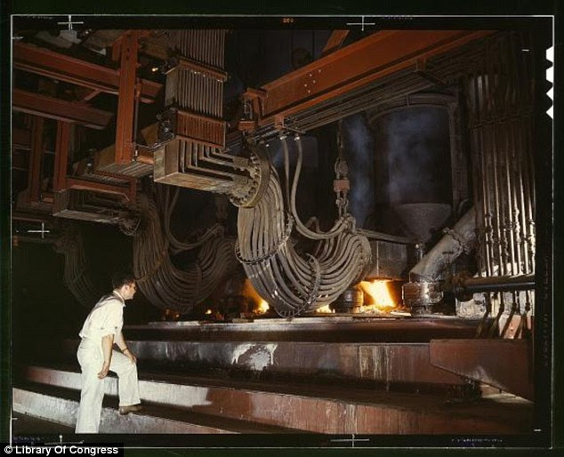 Fire: This electric phosphate smelting furnace was used in the making of elemental phosphorus in Alabama (Alfred Palmer, June 1942)