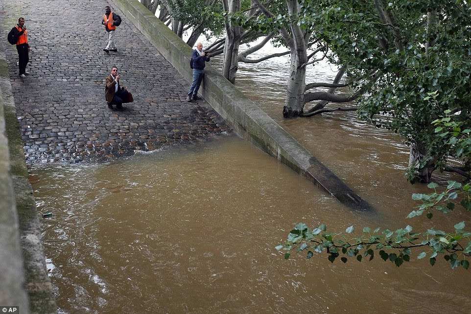 French environment officials say the Seine River will reach its maximum level late Friday as rainfall across the country begins to taper off