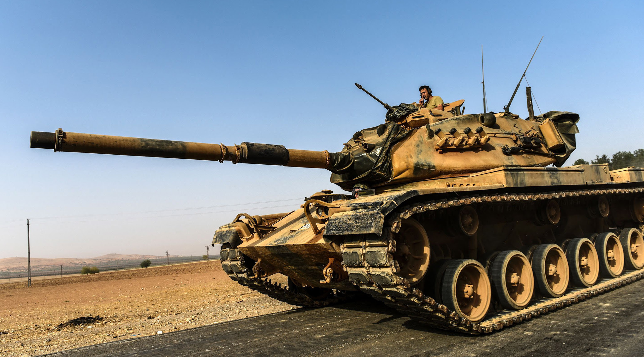 A Turkish army tank drives towards Syria in the Turkish border city of Karkamis, in the southern region of Gaziantep on August 24, 2016. Turkey's army backed by international coalition air strikes launched an operation involving fighter jets and elite ground troops to drive Islamic State jihadists out of a key Syrian border town. / AFP PHOTO / BULENT KILICBULENT KILIC/AFP/Getty Images