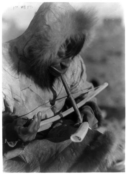 Description of  Title: Drilling ivory--King Island.  <br />Date Created/Published: c1929 February 28.  <br />Summary: Eskimo man, wearing hooded parka, manually drilling an ivory tusk.  <br />Photograph by Edward S. Curtis, Curtis (Edward S.) Collection, Library of Congress Prints and Photographs Division Washington, D.C.