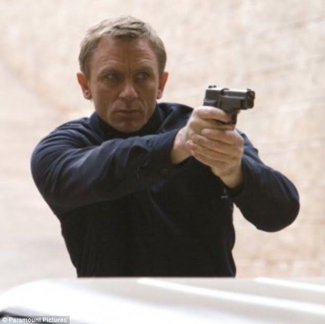 information: Bare-chested Daniel Craig shows off his impressive form as ...