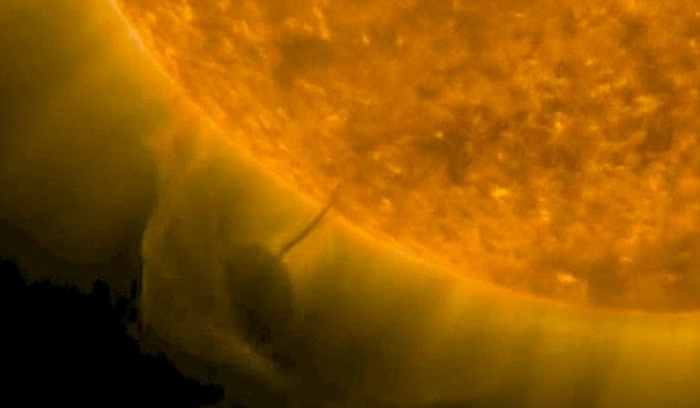 Youtube user 'Sunsflare' captures the strange orb 'anchored' above the visible surface of the sun in photos from Nasa's Solar Dynamics Observatory 