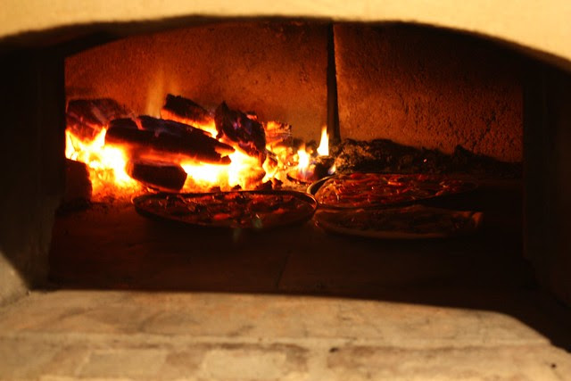 Making pizza in the pizza oven