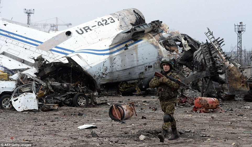 Damage: A commercial aircraft lies destroyed at the region's airport, which came under heavy bombardment during months of fighting