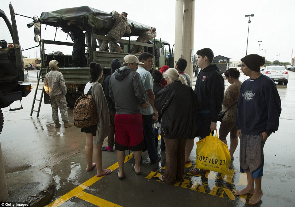 Texas National Guard evacuates families from Pine Forest Village on Tuesday morning 