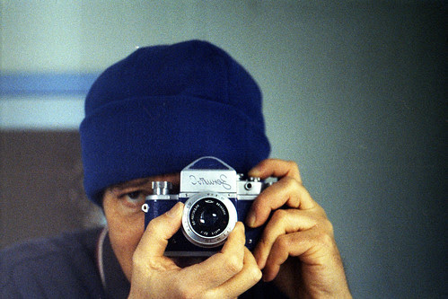 Reflected self-portrait with blue Zenit-C camera and blue hat by pho-Tony