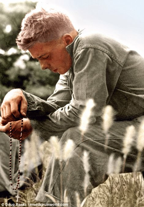 One photo shows a young US Marine praying during a moment of quiet and solitude