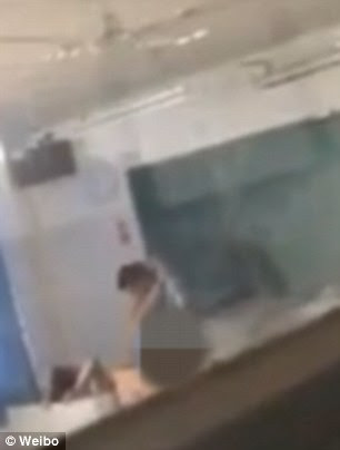 A tutor has been caught on camera allegedly having sex with an alleged student on a classroom desk in broad daylight