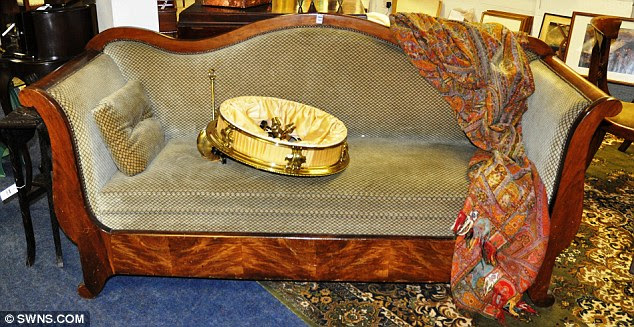 Influence: This wooden-backed sofa featured in 'Original Sin'. Vettriano has decided to sell up after 'spending an increasing amount of time in London'