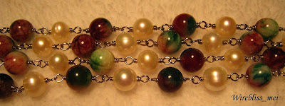 wire wrap long necklace close up wire wrap long necklace with pearl and a stone called "Fuk Luk Sau"