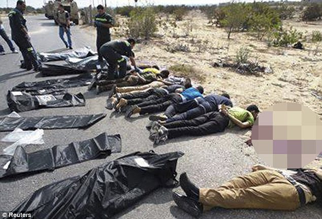 Slaughter: The scene in Sinai following the killing of 31 police officers by militants near Egypt's border with Gaza 