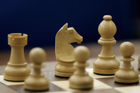 Chess pieces on a chess board.