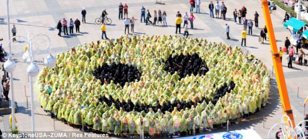 Come on, now, smile: the 768 people's efforts have been approved by the guinness world records as the largest ever human smiley face