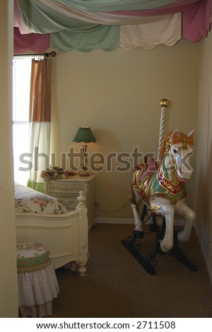Young Girls Bedroom Interior Decorated With Carousel Ho